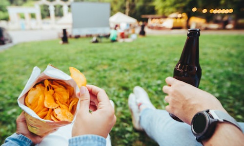 The Best of Brady and Beyond - man hand holding beer bottle woman hand holding chips open air cinema copy space pic by EugenePetrunin on Freepik