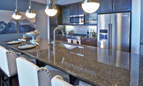 Upgrade Your High-Rise Apartment Experience at Brady - Kitchen with custom cabinetry and 42